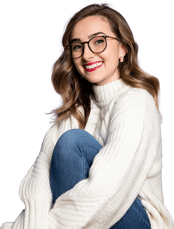 Lauren Mary Moore in white sweater wearing brown glasses